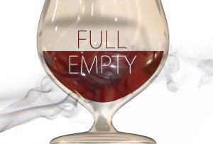 a glass, filled halfway, with the halves labeled "full" and "empty"