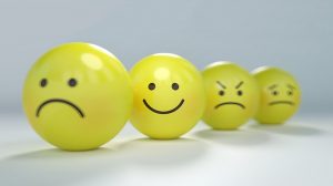 yellow balls decorated with emojis