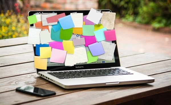 laptop covered in post-its