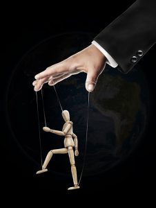 hand controlling a marionette